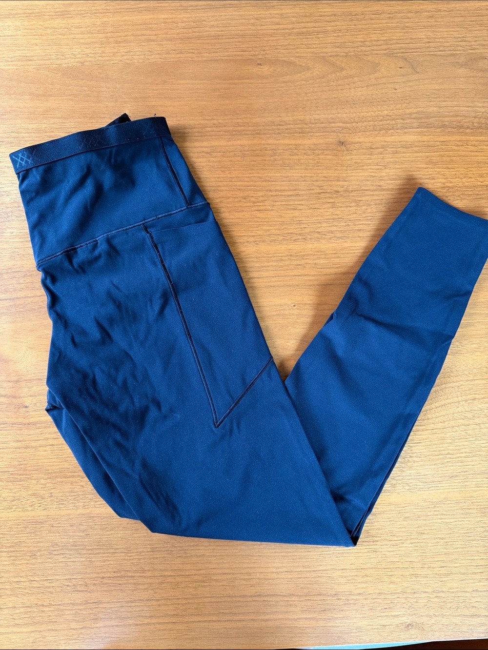 RHONE black athletic leggings with pockets.